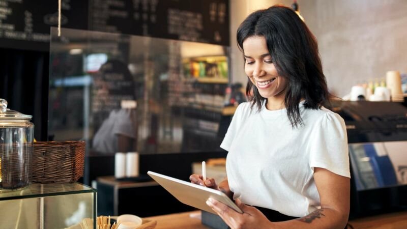 Business owner reviewing a policy on a tablet